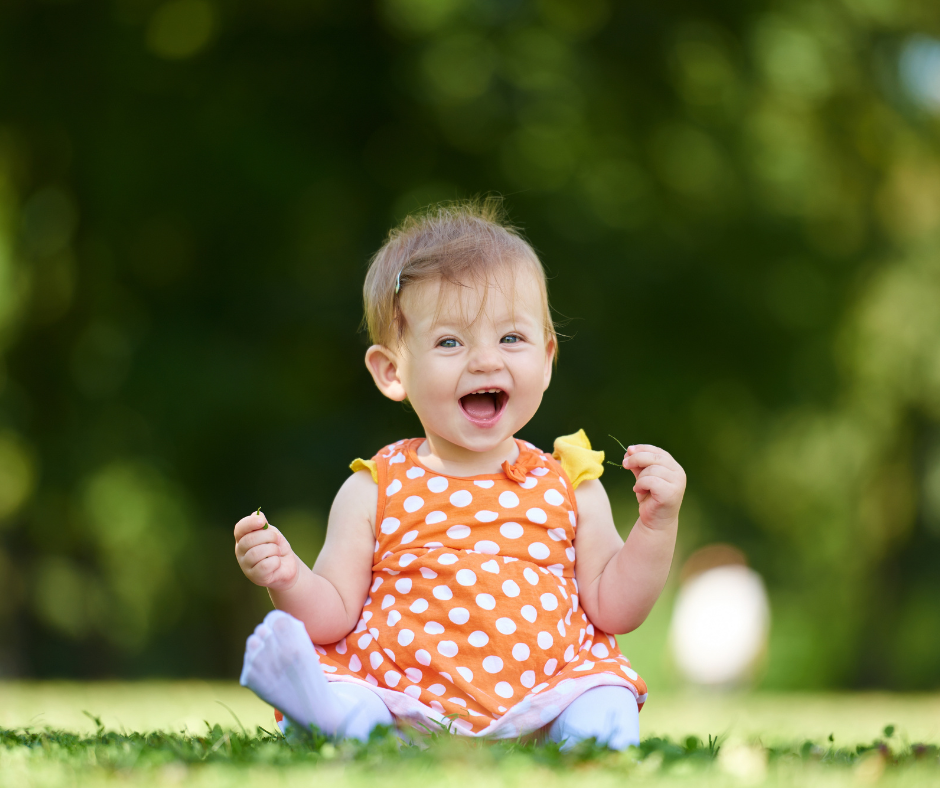 Toddler sitting on the grass